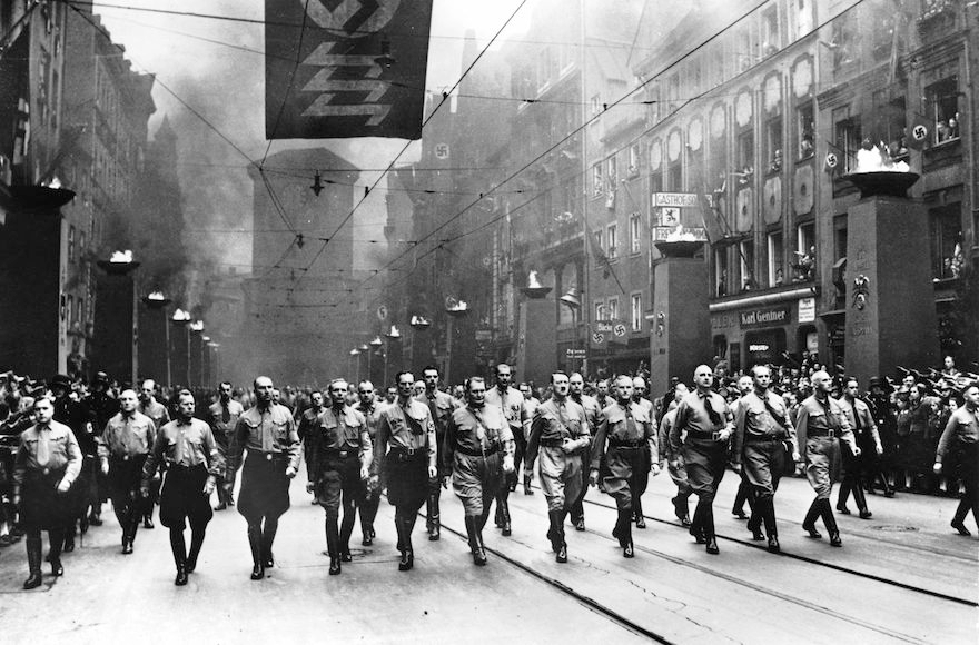 Adolf Hilter, center, and other Nazi officials marching to commemorate the anniversary of the Nov. 9, 1923 march, when the Nazi Party attempted to take power in Bavaria and during which Hitler gave a speech against the Jews that led to Kristallnacht all over Germany. (Keystone-France/Gamma-Keystone via Getty Images)