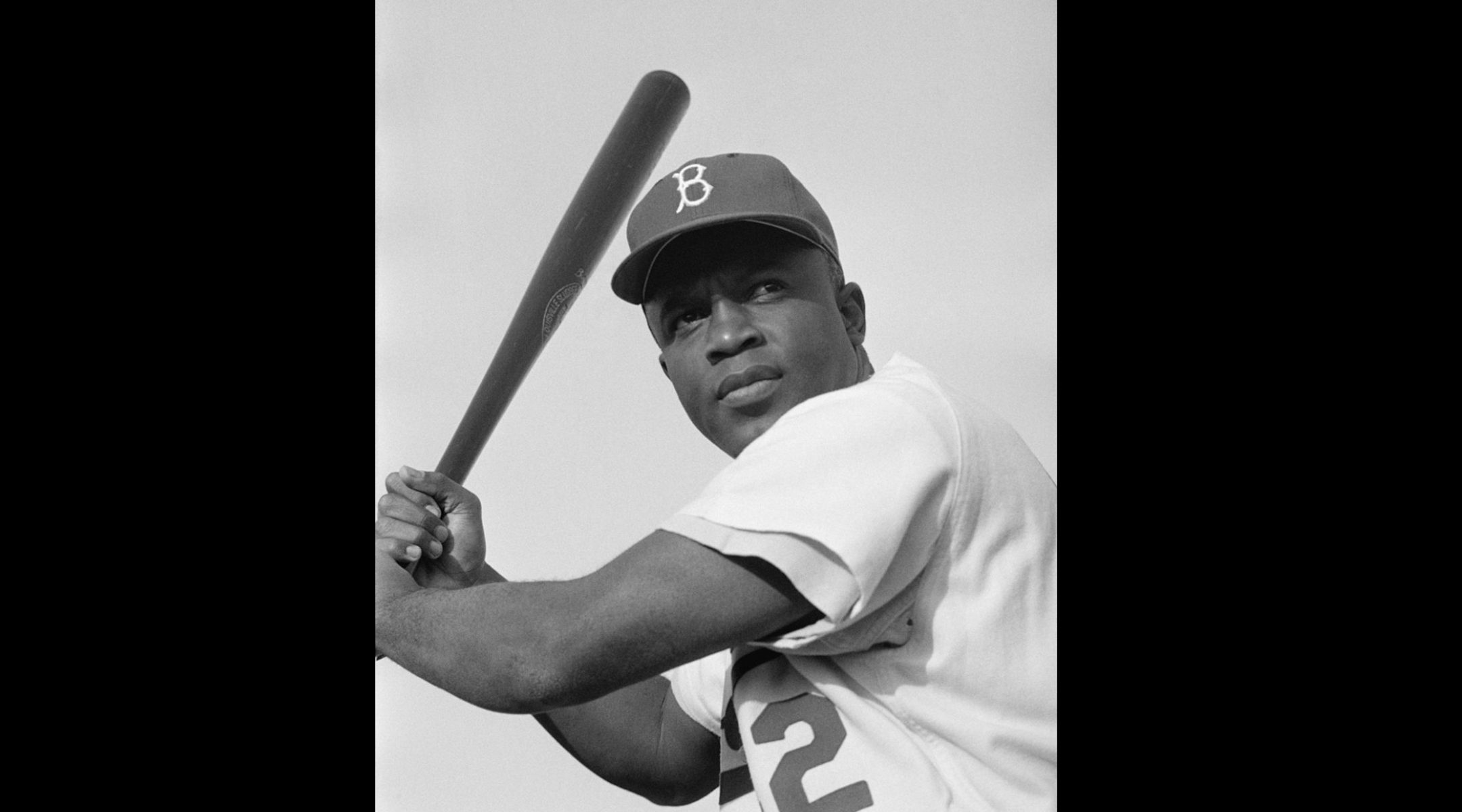 Jackie Robinson holding bat