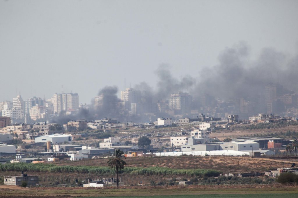 Smoke rising from a building at Northern Gaza Strip after an Israeli Air Force airstrike as seen from the Israeli border side at the third day of Operation Pillar of Defense. Nov. 16, 2012.  (Uri Lenz/ Flash90)