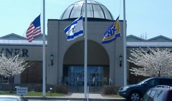 An American and Israeli flag fly outside a Jewish day school in Livingston, N.J. (Courtesy NJJN)