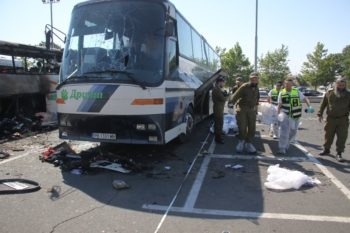 Israeli ZAKA emergency rescue team examining the remains of the bus at the scene of the terrorist attack in Burgas, Bulgaria, July 19, 2012. (Dano Monkotovic/FLASH90)