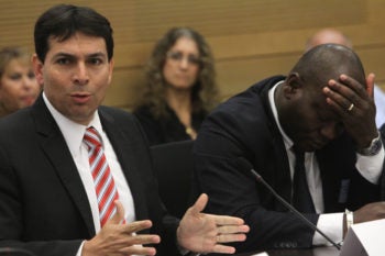 Deputy Knesset Speaker Danny Danon, left, at a Knesset hearing on the issue of African migrants in Israel, sits beside the consul general of the Ivory Coast, June 12, 2012. Danon, who advocates immediate expulsion, chairs a group called Deportation Now. (Miriam Alster/FLASH90)