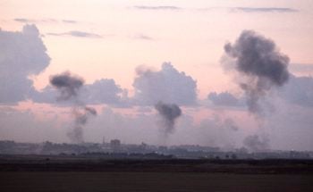 Smoke rising following an Israeli airstrike on a house in Gaza City, Nov. 14, 2012. (Edi Israel/Flash90)