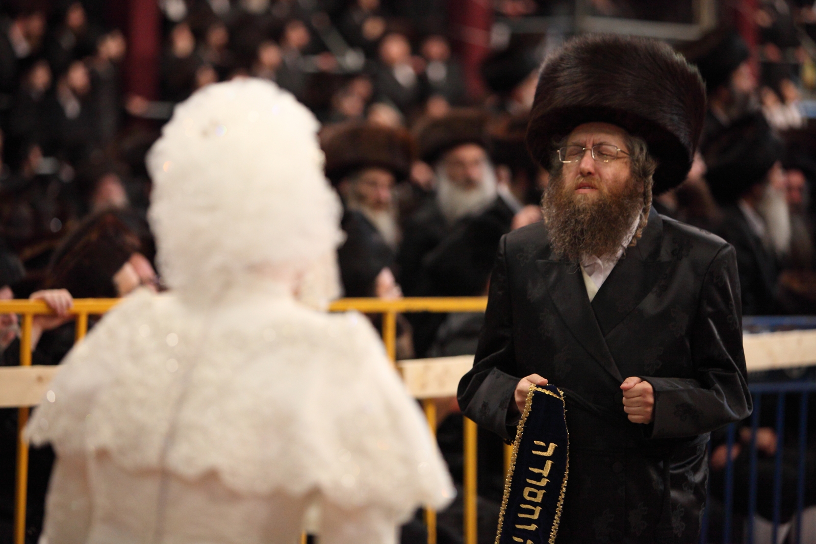 Hana Batya Pener is entreated to a "mitzvah tantz" at her wedding to Rabbi Shalom Rokach, the grandson of the Belz rebbe, May 21, 2013. (Yaakov Naumi/Flash90)