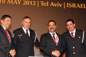 Left to right, Interpol President Khoo Boon Hui, Israeli police chief Yohanan Danino, and Interpol officials Ronald Kenneth Noble and Yoav Segalovitz, at the international police organization's European Regional Conference in Tel Aviv, May 8, 2012. (Gideon Markowicz/Flash90)
