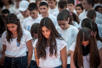 High school students from the Gimnasiya in Jerusalem participate in the ceremony commemorating soldiers killed in the line of duty on Israel's Memorial Day, April 25, 2012. (Noam Moskowitz/flash90)