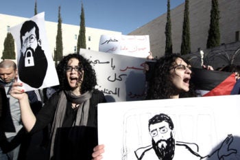 Palestinians demonstrating outside Israel's Supreme Court in Jerusalem in support of Khader Adnan, who declared a hunger strike in Israeli jail more than two months ago, Feb. 21, 2012. Adnan ended his hunger strike that day following an agreement with the State Prosecutor's Office. (Kobi Gideon / Flash90)