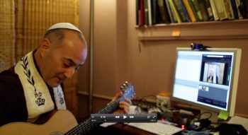 Rabbi Steve Blane, founder and dean of the New York City-based Jewish Spiritual Leaders Institute, broadcasting a Shabbat service over the internet. (Courtesy Rabbi Steve Blane)