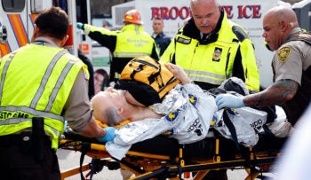 A man is loaded into an ambulance following the Boston Marathon bombings, April 15, 2013. (Jim Rogash/Getty Images)