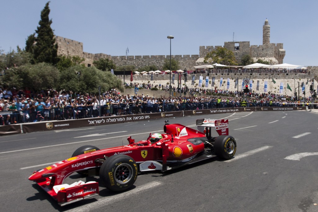 A Formula 1 Ferrari race car driving through Jerusalem's Old City, as part of the Jerusalem Formula Peace Road Show, June 14, 2013. (Flash 90)