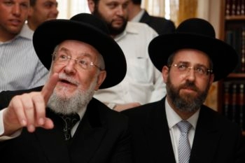 Newly elected Chief Ashkenazi Rabbi David Lau, right, with his father, former Chief Ashkenazi Rabbi Yisrael Meir Lau, July 25, 2013. (Flash90/JTA)