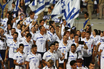 The Israeli delegation to the 19th Maccabiah Games marching at the opening ceremonies at Jerusalem's Teddy Stadium, July 18, 2013. (Yonatan Sindel/Flash90)