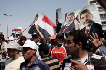 Supporters of ousted Egyptian President Mohamed Morsi demonstrating in front of the headquarters of the Egyptian Republican Guard in Cairo, July 5, 2013. (Ed Giles/Getty Images)