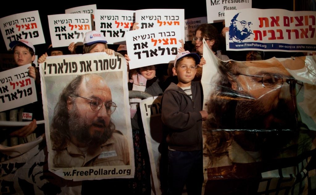 Israelis calling for the release of convicted spy Jonathan Pollard during President Obama's visit to Jerusalem last year. (Uriel Sinai/Getty Images)