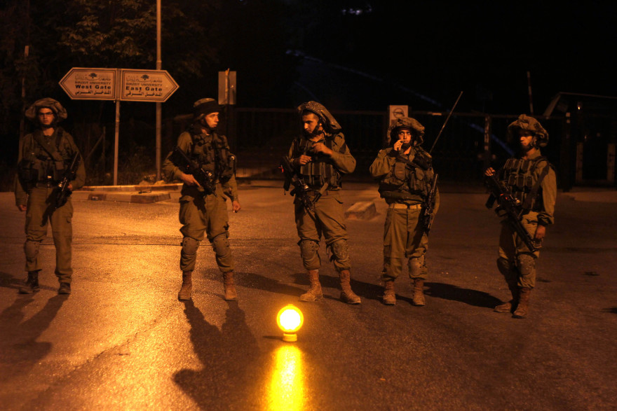 Israeli soldiers patrol at Birzeit University, on the outskirts of Ramallah in the West Bank during an operation on June 19, 2014. Israeli forces broadened the search for three teenagers believed kidnapped by Palestinian militants and imposed a tight closure on the town. (Issam Rimawi/Flash 90)