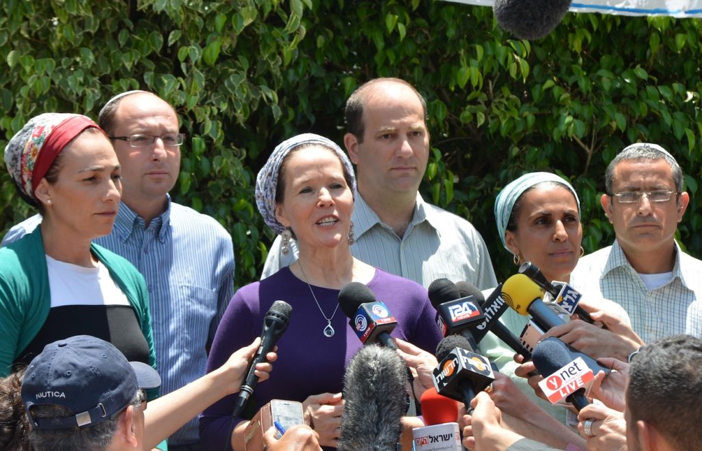 Racheli Frenkel, center, mother of kidnapped teenager Naftali Frenkel, stands with the mothers of the other abducted teens, Eyal Yifrah and Gilad Shaar, outside her home in Nof Ayalon in central Israel, June 17, 2014. (Yossi Zeliger/Flash 90)