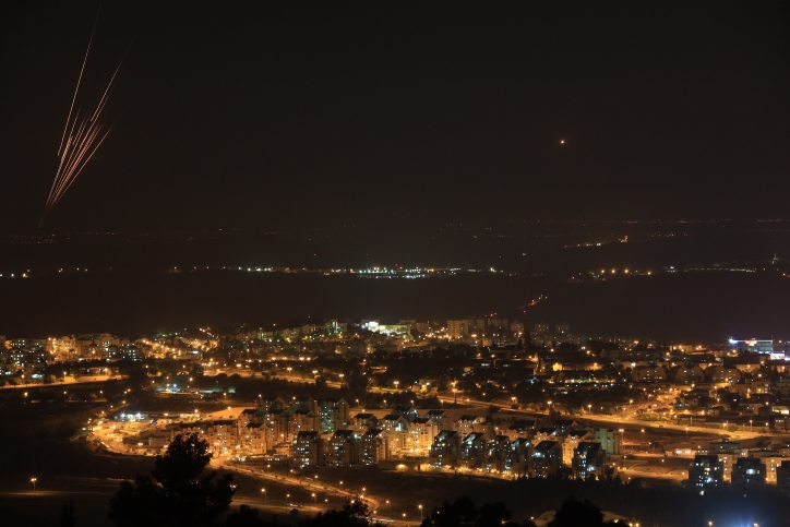 Rockets fired by Gaza Palestinians can be seen in the night sky over southern Israel, July 8, 2014. (Nati Shohat/ Flash90)