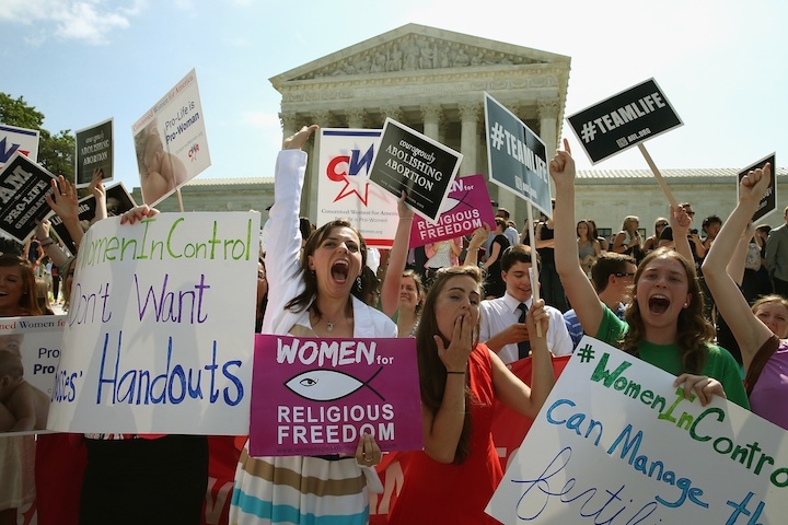 Demonstrators in Washington celebrate the U.S. Supreme Court decision in the Hobby Lobby case, June 30, 2014. (Mark Wilson/Getty Images)