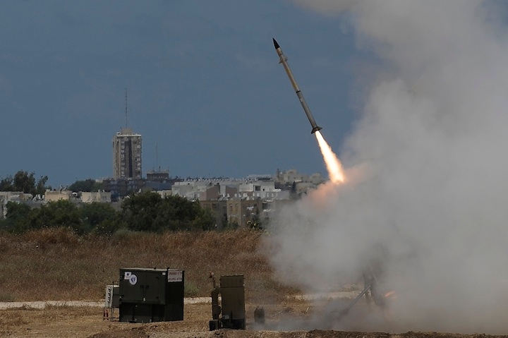 An Iron Dome missile defense battery set up near the southern Israeli town of Ashdod firing an interceptor missile, July 14, 2014. (David Buimovitch/Flash 90)