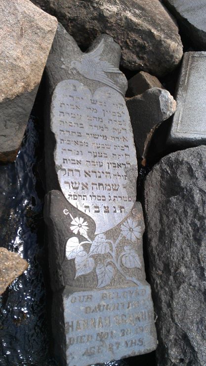 This gravestone found on a Long Island, N.Y., beach set off a search into how it reached there and who was Hannah Schnur, the name on the stone, July 2014. (Courtesy Howard Schoenfeld)