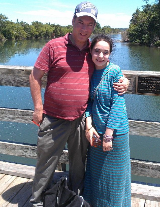 Howard Schoenfeld and his daughter Zahava stumbled upon a mysterious gravestone while strolling on the Long Island beach, July 2014. (Courtesy Howard Schoenfeld)