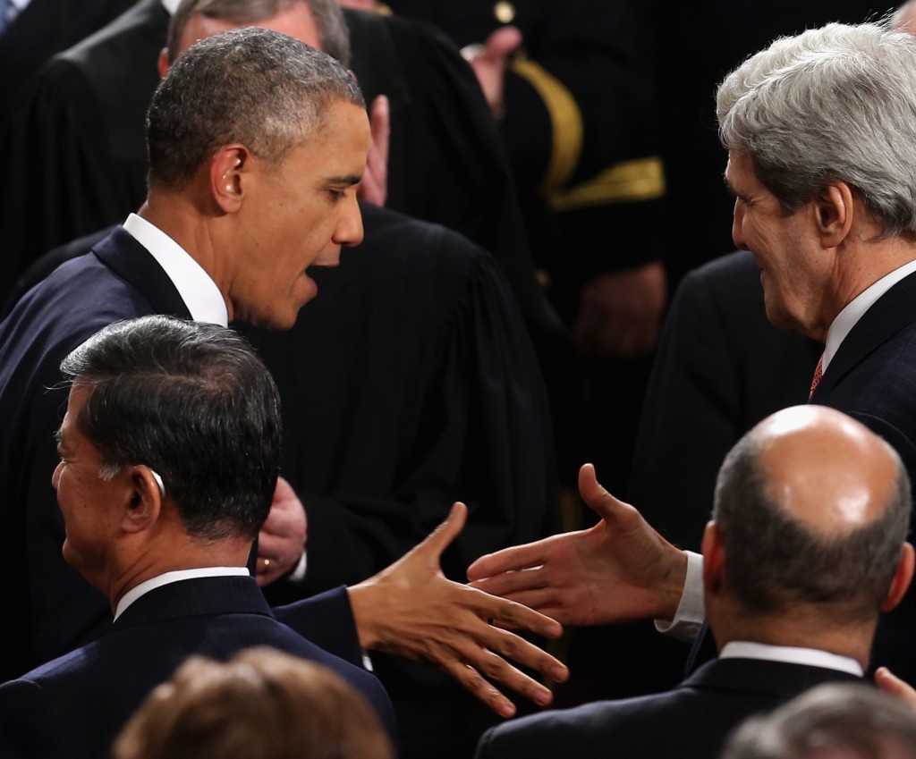 President Obama is greeted by U.S. Secretary of State John Kerry (R) during the State of the Union address to a joint session of Congress in the House Chamber at the U.S. Capitol on Jan. 28, 2014 in Washington, DC. (Mark Wilson/Getty Images)