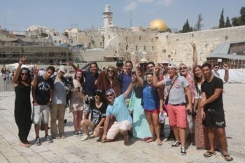Taglit Birthright participants visit at the Western Wall in the Old City of Jerusalem on August 18, 2014. (Flash90)