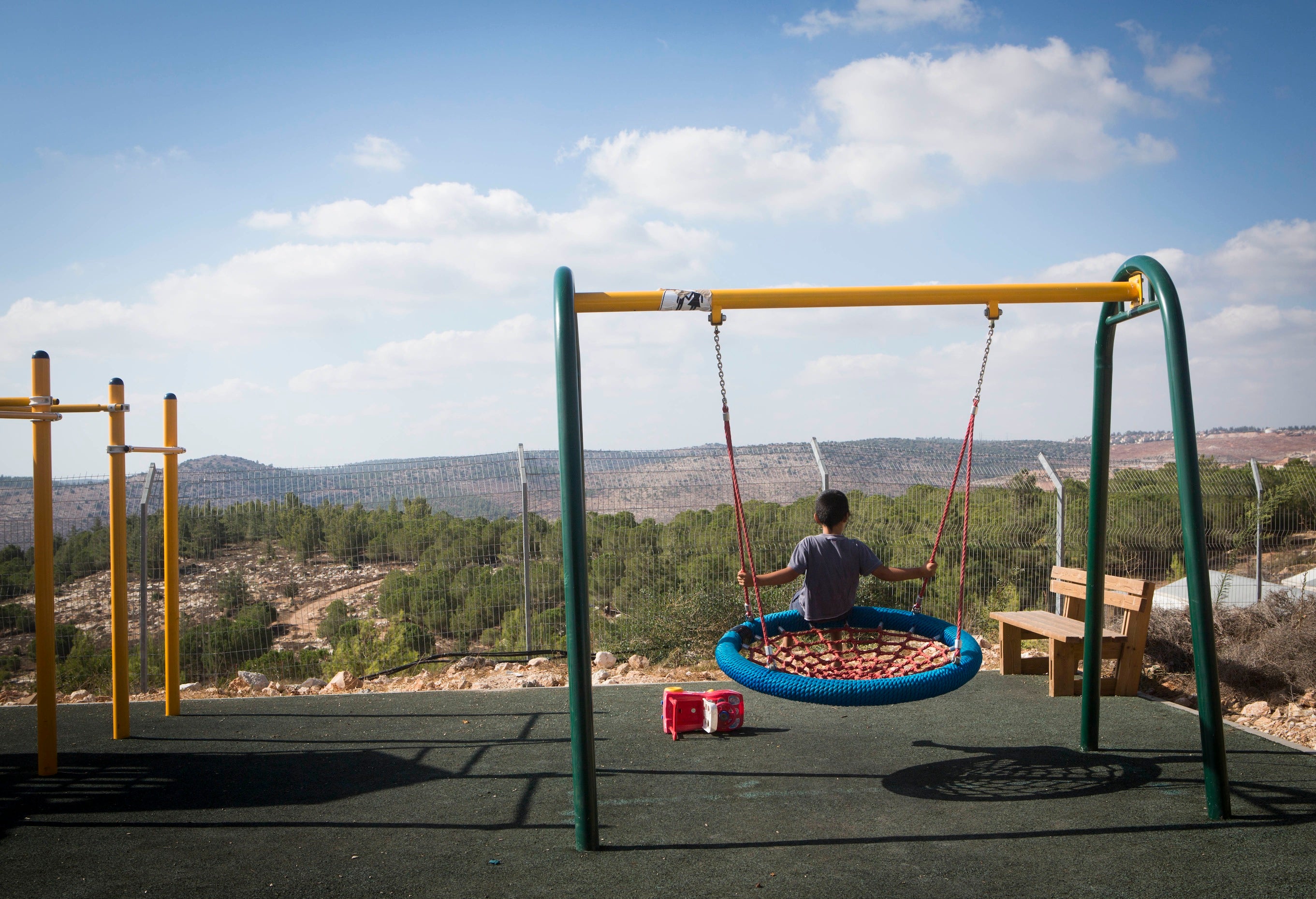 Children seen playing in the streets of the settlement of 