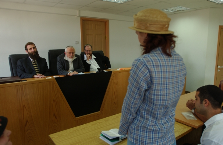 A women converts to Judaism in front of a three-judge Orthodox rabbinic court in Jerusalem. (Flash90)