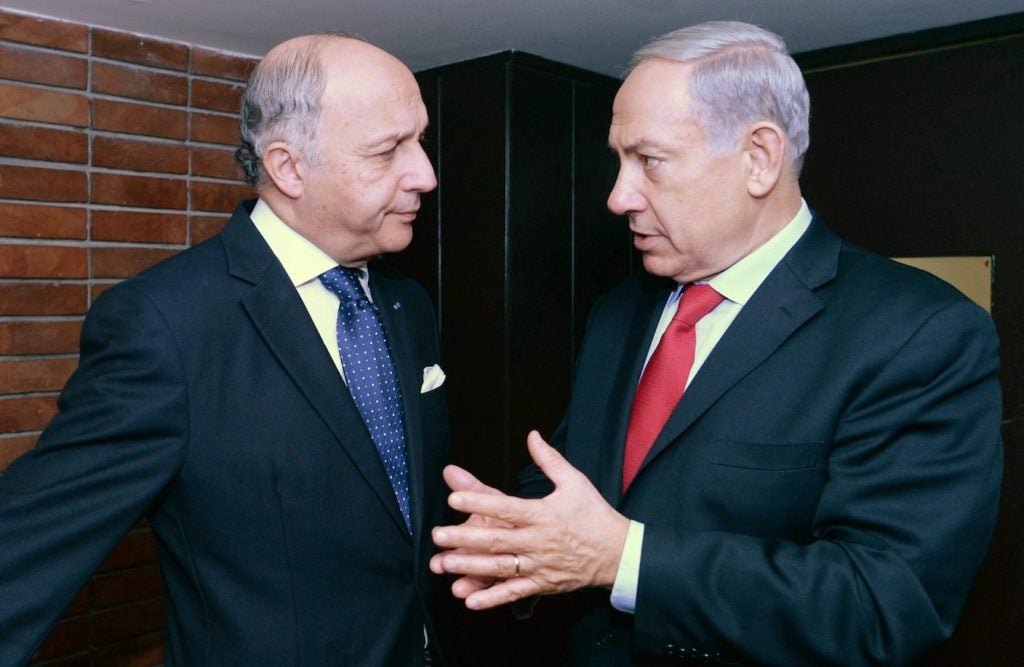 French Foreign Minister Laurent Fabius, pictured during the visit to Israel of President Francois Hollande in November 2013, recently pledged to recognize Palestinian statehood within two years if peace negotiations collapse. (Kobi Gideon/GPO/FLASH90)