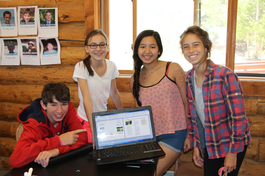 Campers at Camp Inc. create a brochure for their company 
