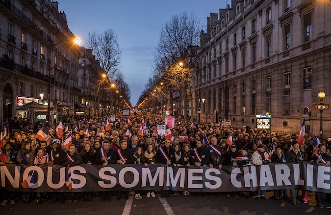 On Jan. 11, 2015 demonstrators make their way along Place de la Republique during a mass unity rally following the recent terrorist attacks in Paris, France. (Photo by Dan Kitwood/Getty Images)