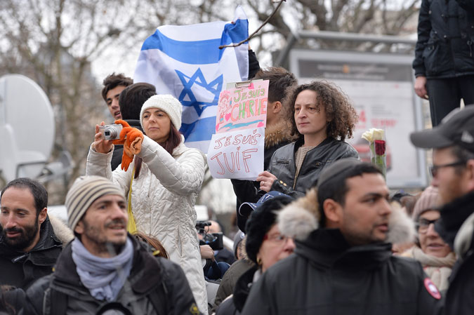 People gather outside the Paris kosher supermarket Hyper Cacher as Benjamin Netanyahu, Prime Minister of Israel, pays his respect to the victims following the recent terrorist attacks on January 12, 2015. (Aurelien Meunier/Getty Images)