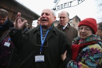 Mordechai Ronen, who was a prisoner at the Auschwitz concentration camp when he was an 11-year-old child and lost his mother, father and sisters there, breaks into tears as he walks through the camp, which is now a museum, Jan. 26, 2015 in Oswiecim, Poland. (Sean Gallup/Getty Images)