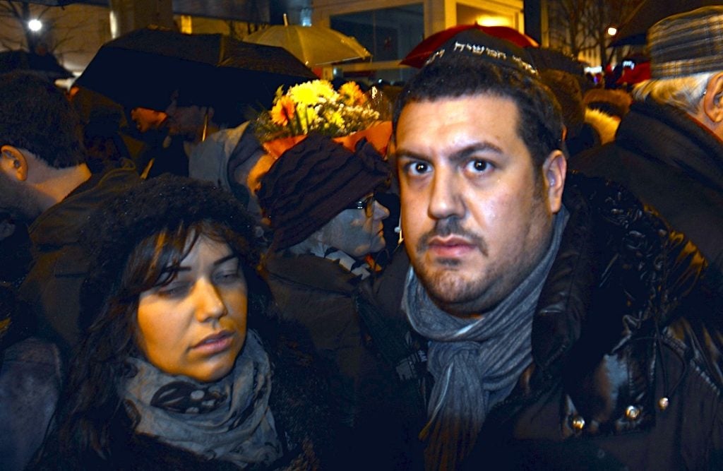 Joyce Halimi, left, and her husband Julien attending a vigil for victims of an attack on a kosher supermarket in Paris, Jan. 10, 2015. (Cnaan Liphshiz)