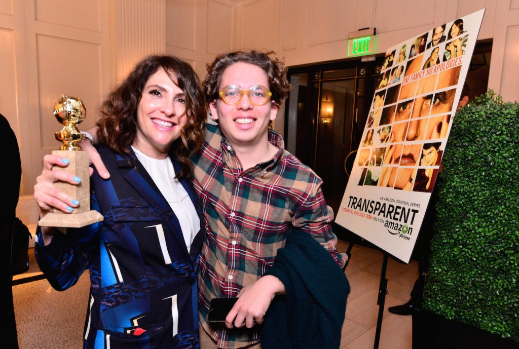 Show creator/director Jill Soloway (L) and her son Isaac attend the 'Transparent' Cast and Crew Golden Globes Viewing Party, Jan. 11, 2015 in West Hollywood, Calif. (Jerod Harris/Getty Images for Amazon Studios)