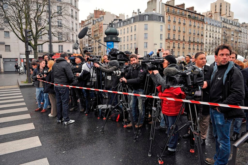 Media stand by as police mobilize with reports of a hostage situation at Port de Vincennes on Jan. 9, 2015 in Paris. (Aurelien Meunier/Getty Images)