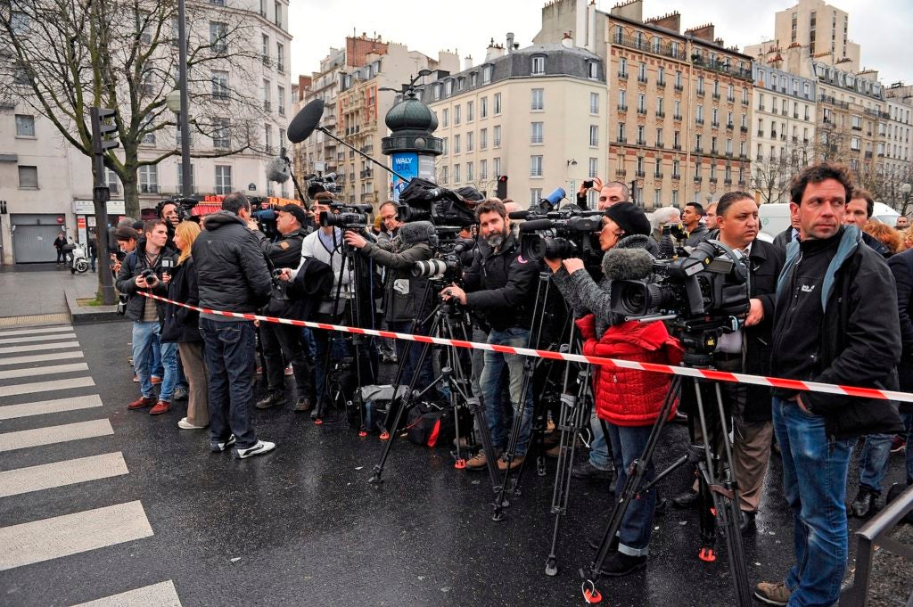 Media stand by as police mobilize with reports of a hostage situation at Port de Vincennes on Jan. 9, 2015 in Paris. (Aurelien Meunier/Getty Images)