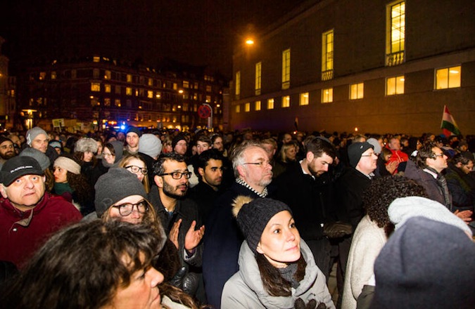 Thousands attend a solidarity march at Copenhagen's Great Synagogue following the slaying of a Jewish volunteer guard outside the building early Sunday morning. 