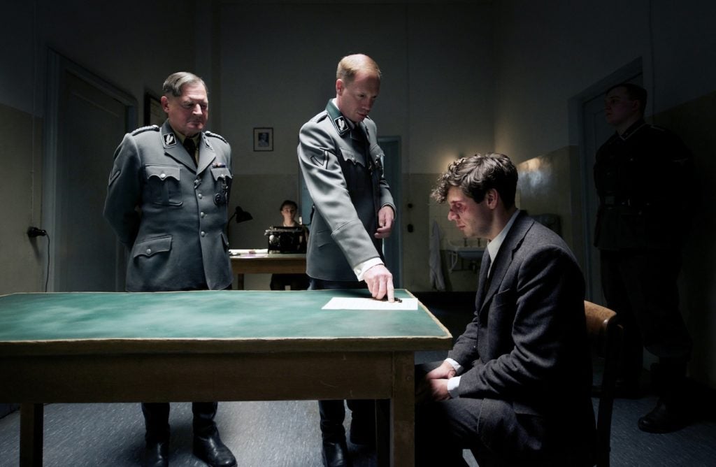 Nazi police chief Arthur Nebe (Burghart Klaussner), left, and Gestapo head Heinrich Muller (Johann von Bülow), insisting that a beaten Georg Elser (Christian Friedel) confess in the new film