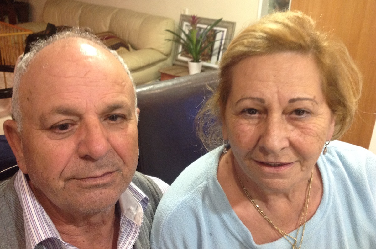 Rafael Nahum and his wife, Doris, are loyal Labor party voters. But their son Momi supports Yesh Atid, a relatively new centrist party with a charismatic leader. (Ben Sales)