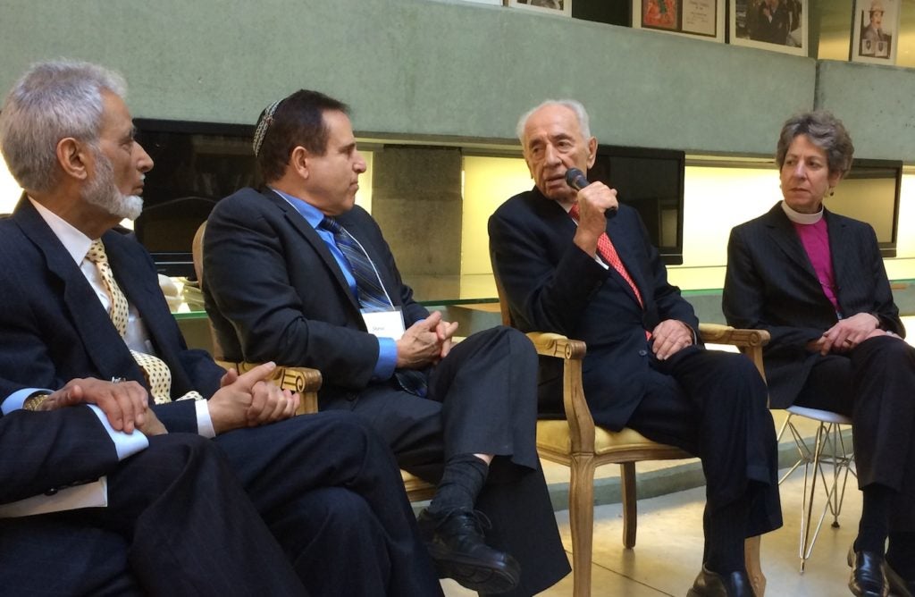 Former Israeli President Shimon Peres meeting in Tel Aviv with, from left, Sayyid Syeed of the Islamic Society of North America, Rabbi Steve Gutow of the Jewish Council for Public Affairs, and Katharine Jefferts Schori, presiding bishop of the Episcopal Church of the United States, Jan. 20, 2015. (JCPA)