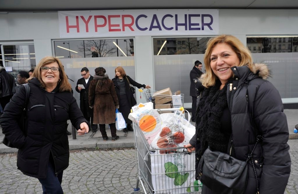 Shoppers outside the Hyper Cacher market near Paris, where four people were murdered in January. The shop reopened on March 15, 2015. (Serge Attal/Flash90)