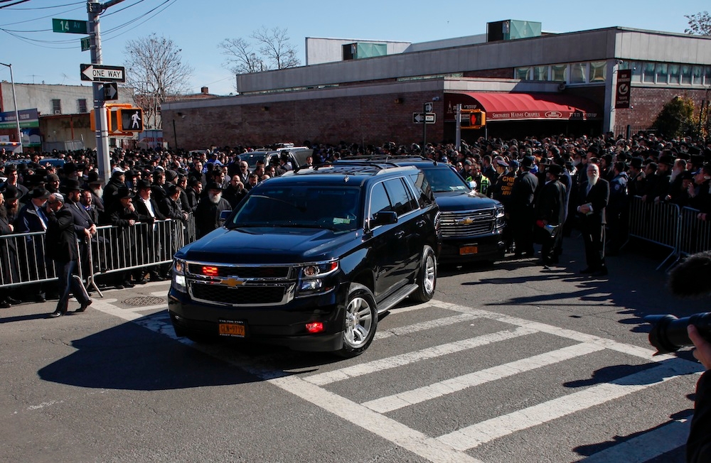 The funeral procession for seven children who died in a house fire departing a funeral home in the Borough Park section of Brooklyn on the way to the airport for burial in Israel, March 22, 2015. (Kena Betancur/Getty Images)