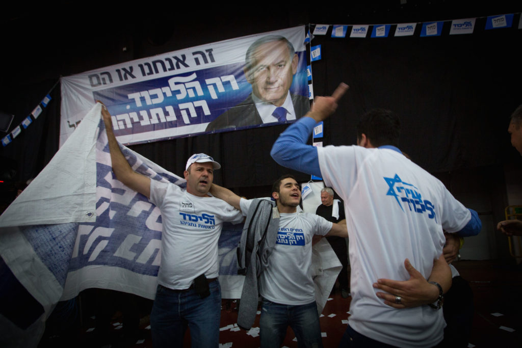 Supporters of the Likud party celebrate at party headquarters in Tel Aviv, March 18, 2015. (Miriam Alster/FLASH90)