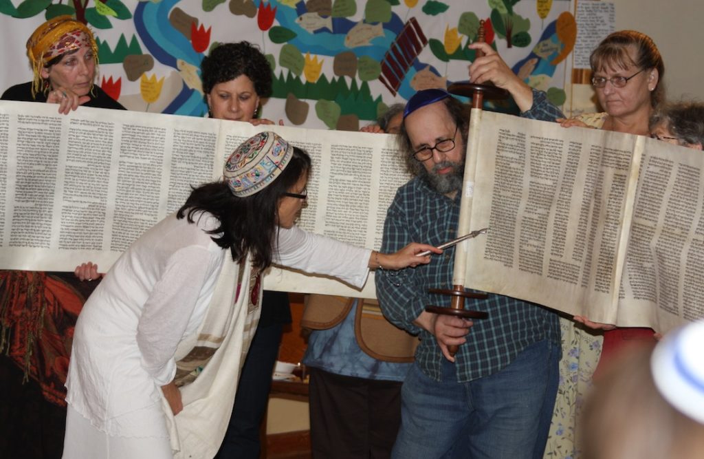Rabbi Ariel Stone, in white, and the congregants of Shir Tikvah, the only synagogue on Portland's east side. (Gary Teasdale) 