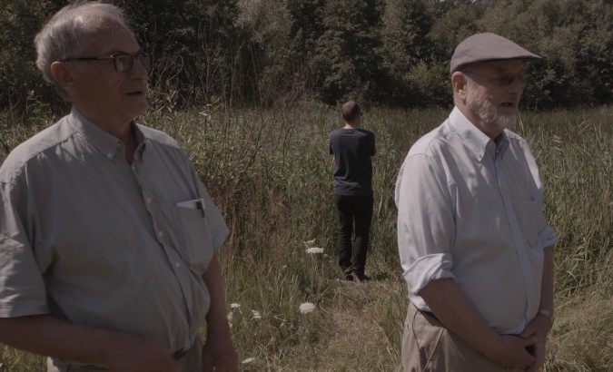 Horst von Wachter, left, and Niklas Frank with Philippe Sands, rear, at the site of a mass grave outside Zolkiew, Ukraine. (Sam Hardy)