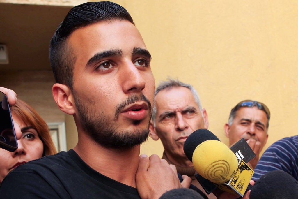 Niv Asraf speaks at a press conference outside his family home in Beersheva,April 6, 2015, a few days after he was found in Kiryat Arba after being falsely reported as missing. (Flash90)