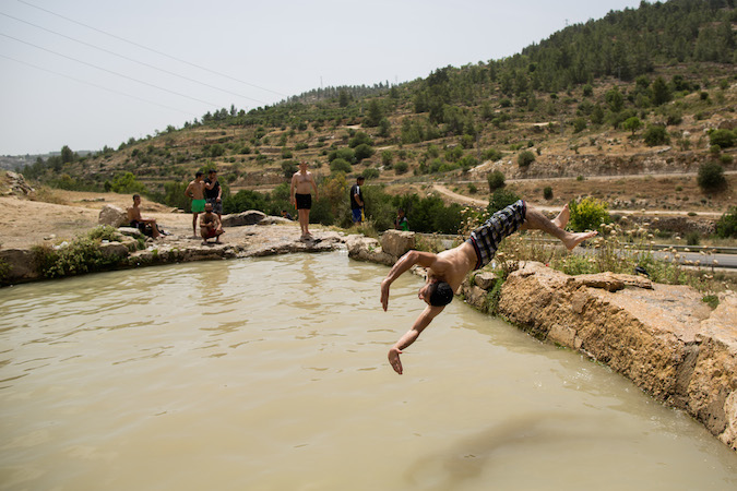 israel heat wave swimming