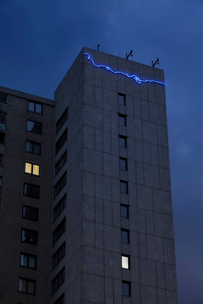 Agnieszka Kurant's "The End of Signature" projected on to a shopping mall in Holland in 2013. (Jannes Linders)